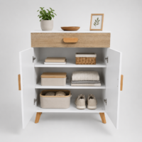 Meuble de rangement scandinave blanc avec tiroir finition chêne clair, deux portes et pieds en bois naturel sur fond blanc élégant.