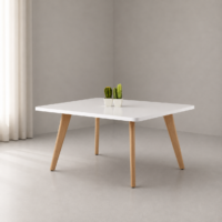 Table basse blanche rectangulaire avec pieds en bois naturel, intégrée dans un salon moderne et minimaliste.