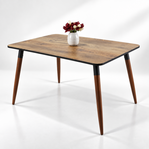 Table à manger rectangulaire en bois avec pieds inclinés style scandinave sur fond blanc épuré.