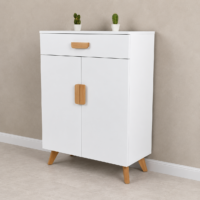 Meuble de rangement blanc style scandinave avec pieds en bois naturel, intégré dans une entrée moderne avec plante décorative et cadre mural minimaliste.