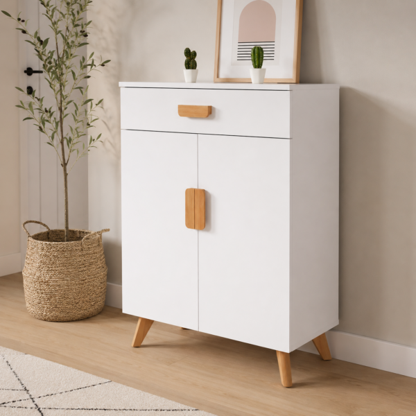 Meuble de rangement blanc style scandinave avec pieds en bois naturel, intégré dans une entrée moderne avec plante décorative et cadre mural minimaliste.