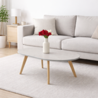Table basse ovale gris clair avec pieds en bois naturel intégrée dans un salon moderne et minimaliste.