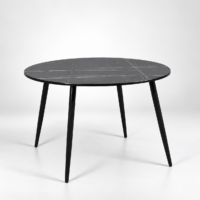 Table ronde noire effet marbre intégrée dans un intérieur chic et élégant, sans chaises