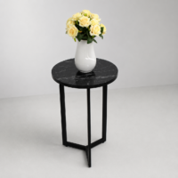 Table d'appoint ronde effet marbre noir avec structure en métal noir, idéale pour le salon, la chambre ou un coin décoration moderne.