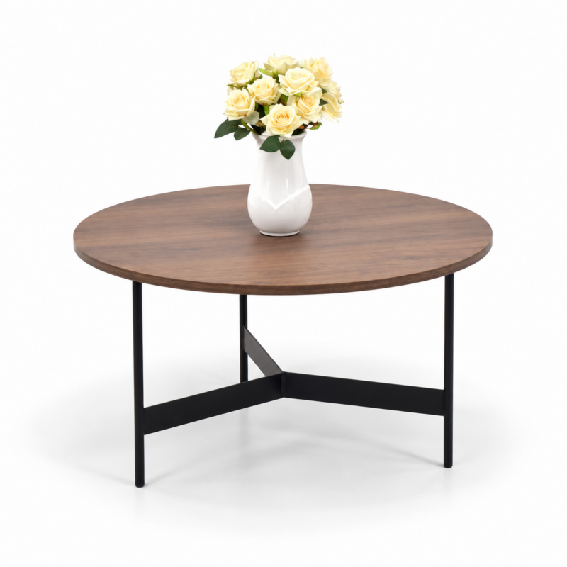 Table ronde en bois marron avec piètement métallique noir dans un intérieur moderne