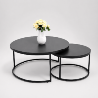 Ensemble de deux tables basses gigognes rondes noires au design moderne avec structure métallique.