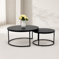 Ensemble de deux tables basses gigognes rondes noires au design moderne avec structure métallique.