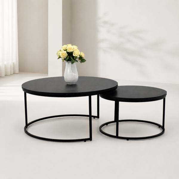 Ensemble de deux tables basses gigognes rondes noires au design moderne avec structure métallique.