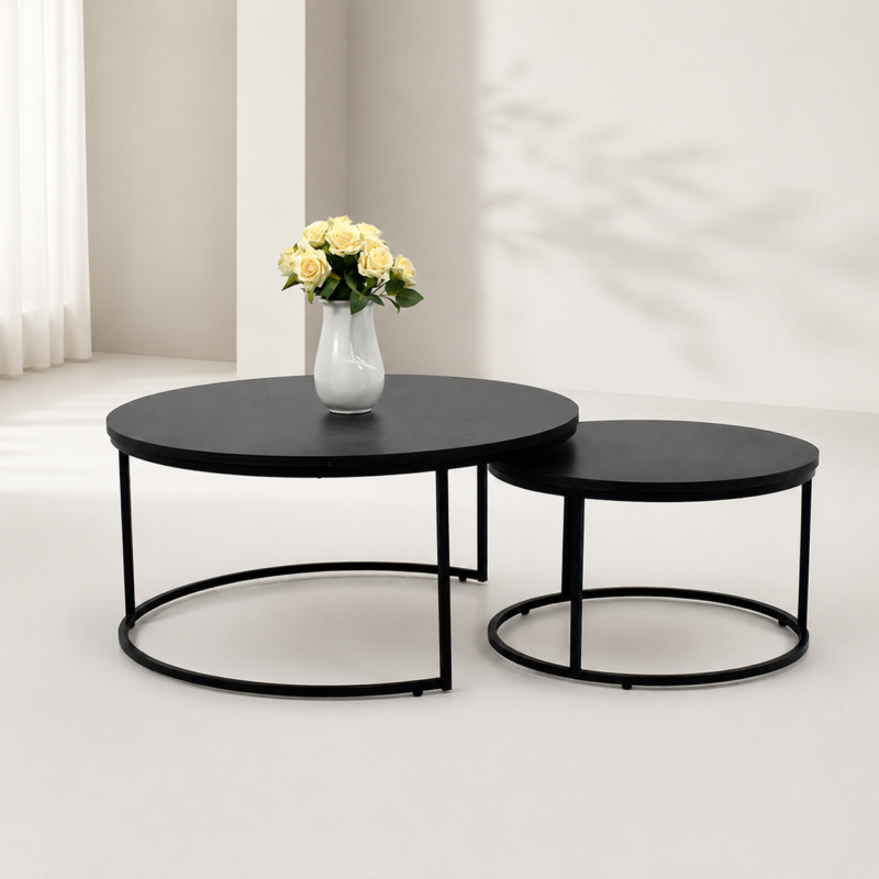 Ensemble de deux tables basses gigognes rondes noires au design moderne avec structure métallique.